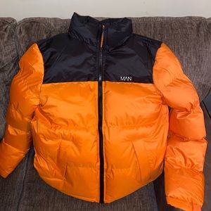 Men’s Orange/Black puff coat. Size Large